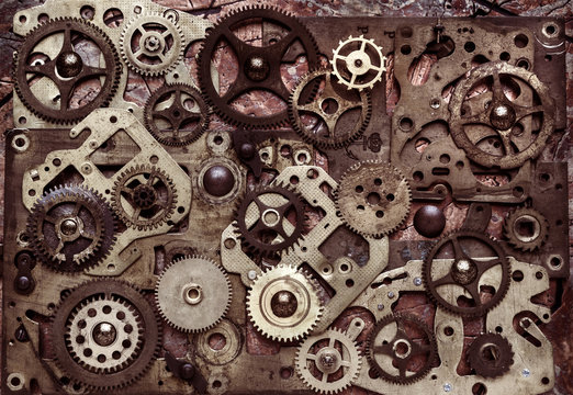Composition of many brass gears of various sizes. Steampunk background.