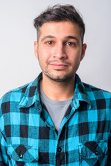 Obraz premium Face of young handsome Persian hipster man