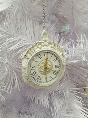 Christmas decoration vintage clock on a white Christmas tree