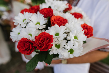 Beautiful wedding bouquet with fresh flowers on a wedding day