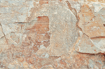 Stone texture. Natural stone close-up. Stone old wall. Structural surface close-up. Granite natural surface. Texture pattern.