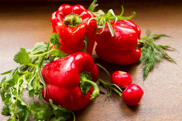 Three red peppers and three radishes