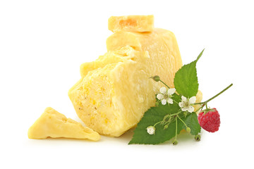 Solid raspberry honey with sprig, flowers and berry of raspberry isolated on white