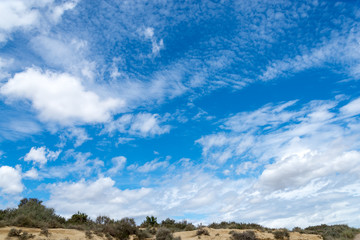 Spring sky with clouds above the badlands Bardenas Reales in the southeast of Navarre