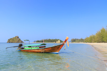 Long tail boat waiting for tourists at Noppharat Thara beach in Andaman sea, Krabi, Thailand