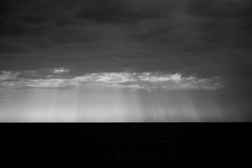 Fototapeta premium Rays of light during stormy morning weather