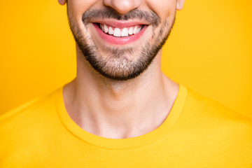 Closeup cropped photo of amazing macho guy looking mirror examining teeth after dental laser...