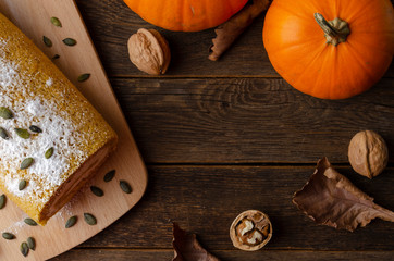 Pumpkin Roll with powdered sugar with walnuts and pumpkin seeds