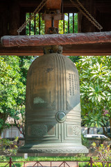 Naklejka premium Big bell on side of Imperial Academy in Temple of Literature (Van Mieu), the first national university in Hanoi