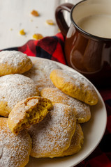 Pumpkin vegan cookies with oat milk on wood