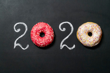 Donuts 2020 inscription on chalk board