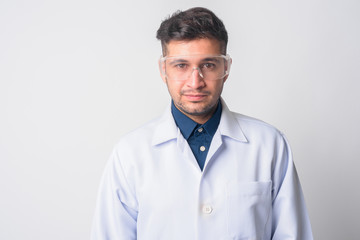 Face of young Persian man doctor as scientist