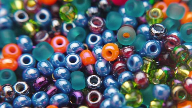 A variety of jewelry beads during jewelry making.