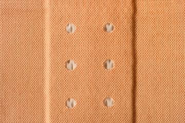 Band aid in close-up. Adhesive bandage background.