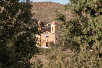 Fototapeta premium Landscape of Sierra Nevada with the church of Tices (Spain)