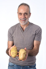 portrait of a man with potatoes on white background