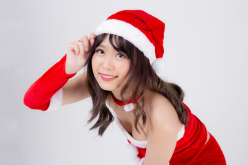 Beautiful portrait young asian woman Santa costume wear hat smiling with happy in holiday xmas, beauty model asia girl cheerful and happiness celebrating in Christmas isolated on white background.