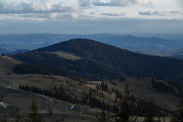 snow-capped peaks of the mountains. clouds walking in the evenings over the mountains