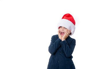 young boy wearing a Santa hat and looking surprised isolated on white background