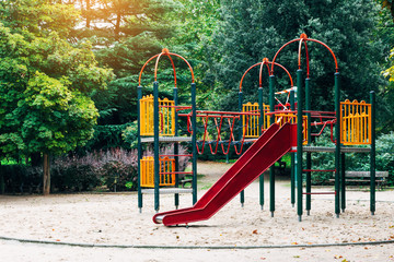 Fototapeta na wymiar slide and swings in the city park