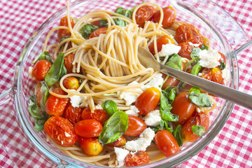 crudaiola pasta with cherry tomatoes basil and mozzarella