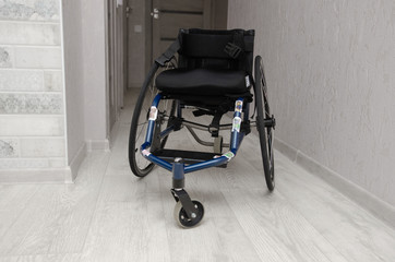 Empty baby wheelchair indoors. Disability Problem Concept