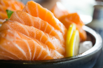 Salmon raw on a plate. Salmon sashimi.