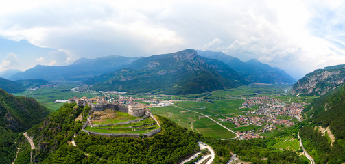 Aerial view of Beseno Castle and northern vineyards, the largest fortified structure in Besenello, Trento, Italy. wide panorama with high resolution, touristic place in Europe