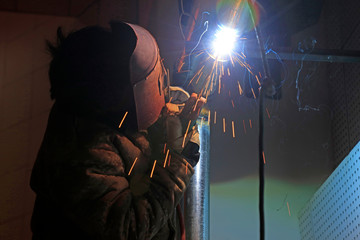 Workers welding operation