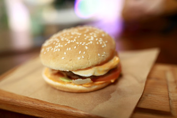Cheeseburger on wooden board