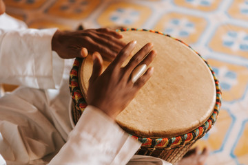 Close up of man hands playing djembe in Morocco, Africa.