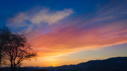 cold morning. beautiful landscape of snow-covered mountains. Magic winter sunrise on a peak of hill