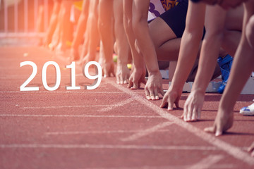 2019 Happy New year Concept. Side view of a Sport Man on Start line, Get Ready for New Challenge