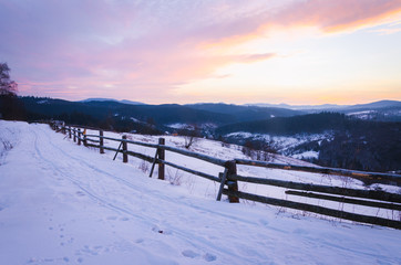 cold morning. beautiful landscape of snow-covered mountains. Magic winter sunrise on a peak of hill