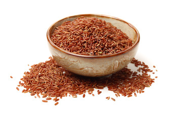 Red rice on white background 