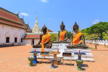 Fototapeta na wymiar Buddha statues near relic pagoda stupa at Wat Phra Borommathat Chaiya Worawihan, Surat Thani