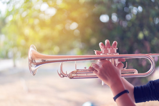 Music concept,Trumpet instrument. Music player trumpeter jazz playing. Brass instruments cornet hands