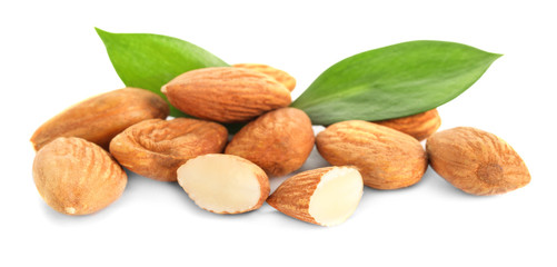 Tasty almonds on white background