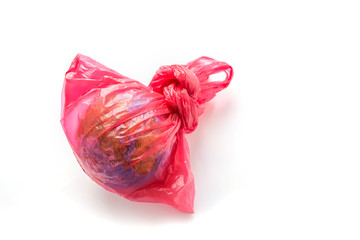 A globe in plastic bag isolated white background. Earth Day. Ecology problem. Environmental pollution.