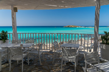 Picturesque terrace on the coast of the azure sea.