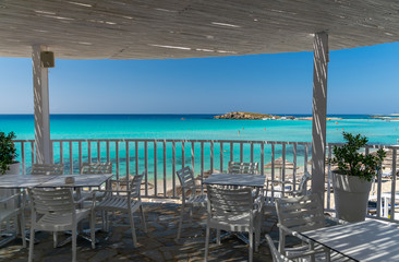 Picturesque terrace on the coast of the azure sea.