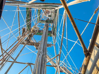 Drilling a well in winter at a northern oil and gas field. The drilling rig is covered in snow....