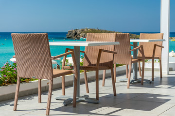 Picturesque terrace on the coast of the azure sea.