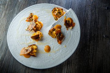 trendy decorated restaurant dessert of crushed cupcakes with sweet sauce