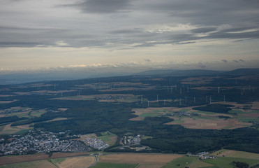  windmills station with propellers generating alternative clean green power in Germany,2019