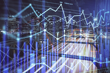 Forex chart on cityscape with tall buildings background multi exposure. Financial research concept.