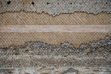 Abstract authentic pattern of the ancient stone pattern. Wall of the typical italian colours, great texture
