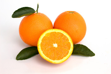 oranges with leaves isolated on white background