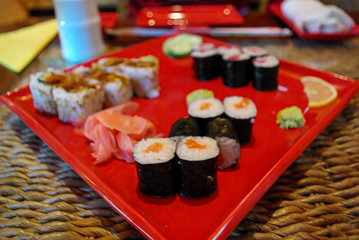 Asian fast food style, set of different sushi in a big red tray, details, closeup