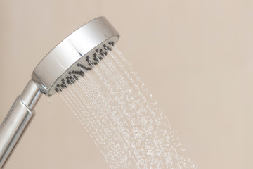 Stainless steel shower in the bathroom that opens to allow water to flow To prepare to take a shower.